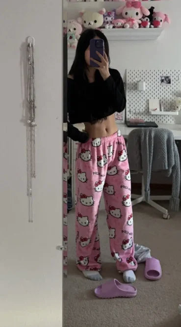 Couple wearing matching Hello Kitty pajamas